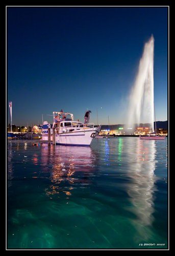 Geneva's Fountain at nightfall before the first fireworks of the Geneva Festival 2010